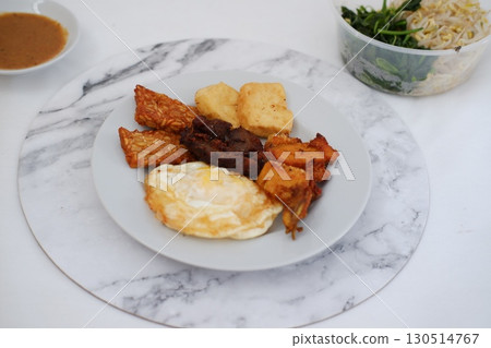 Homemade Indonesian Meal with Tempeh and Tofu 130514767