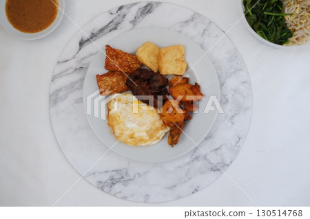 Homemade Indonesian Meal with Tempeh and Tofu 130514768