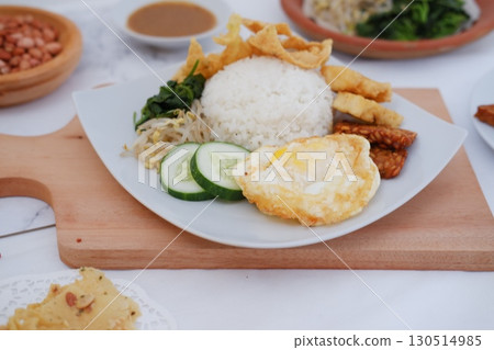 Fried Tempeh, Tofu, Egg, and Meat on Plate Fried Tempeh, Tofu, Egg, and Meat on Plate 130514985