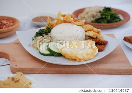 Fried Tempeh, Tofu, Egg, and Meat on Plate Fried Tempeh, Tofu, Egg, and Meat on Plate 130514987