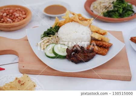 Fried Tempeh, Tofu, Egg, and Meat on Plate Fried Tempeh, Tofu, Egg, and Meat on Plate 130515000
