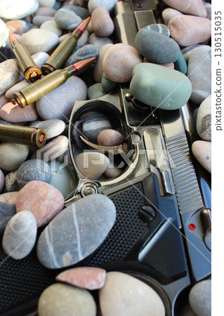 Crime Scene With Gun Covered With Sea Stones And Scattered Ammunition Crime Scene With Gun Covered With Sea Stones And Scattered Ammunition 130515035