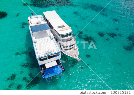 Aerial view of two recreational vessels over turquoise clear water at Racha Island, Phuket, Thailand 130515121