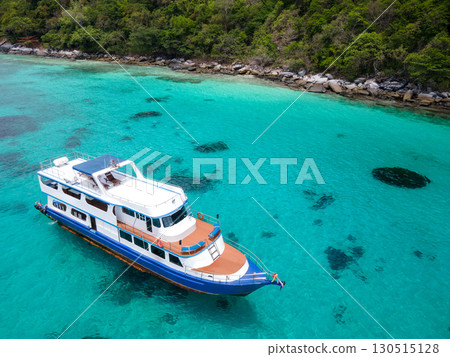 Aerial view of scuba diving boat over turquoise clear water at Racha Island in Phuket, Thailand. 130515128