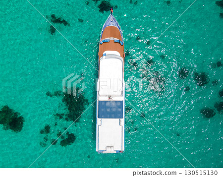 Aerial view of scuba diving boat over turquoise clear water at Racha Island in Phuket, Thailand. 130515130