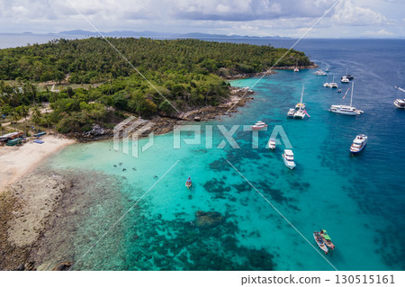 Aerial view of Koh Racha Yai Island with many tour boats in Phuket, Thailand Aerial view of Koh Racha Yai Island with many tour boats in Phuket, Thailand 130515161