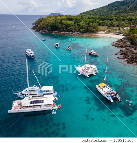 Aerial view of Koh Racha Yai Island with many tour boats in Phuket, Thailand Aerial view of Koh Racha Yai Island with many tour boats in Phuket, Thailand 130515165