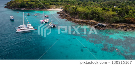 Aerial view of Koh Racha Yai Island with many tour boats in Phuket, Thailand Aerial view of Koh Racha Yai Island with many tour boats in Phuket, Thailand 130515167