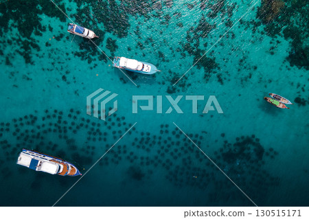 Aerial view of tour boats anchoring over the artificial reef at Racha Yai Island, Phuket, Thailand 130515171