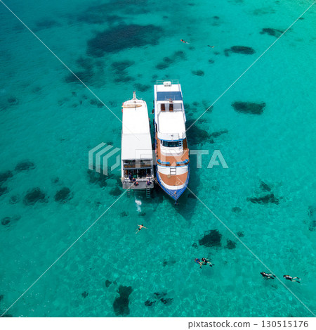 Aerial view of two boats anchoring over turquoise clear water at Racha Island in Phuket, Thailand. 130515176