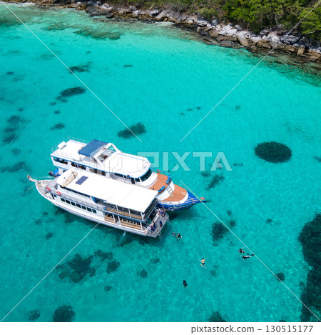 Aerial view of two boats anchoring over turquoise clear water at Racha Island in Phuket, Thailand. 130515177