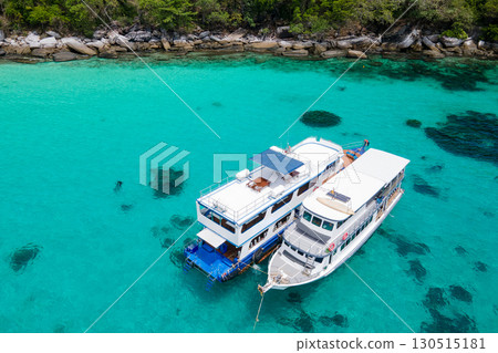 Aerial view of two boats anchoring over turquoise clear water at Racha Island in Phuket, Thailand. 130515181