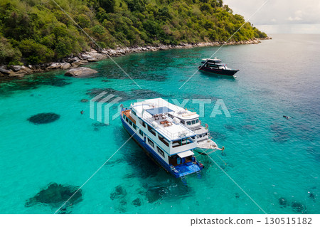 Aerial view of boats anchoring over turquoise clear water at Racha Island in Phuket, Thailand. 130515182