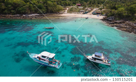 Aerial view of Koh Racha Yai Island with tourboat and longtail boat anchoring in front of the bay 130515201