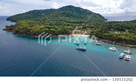 Aerial view of Koh Racha Yai Island with many tour boats around the bay in Phuket, Thailand. Aerial view of Koh Racha Yai Island with many tour boats around the bay in Phuket, Thailand. 130515202
