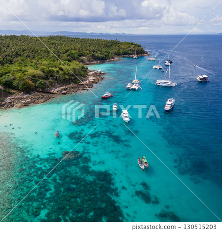 Aerial view of Koh Racha Yai Island with many tour boats around the bay in Phuket, Thailand. Aerial view of Koh Racha Yai Island with many tour boats around the bay in Phuket, Thailand. 130515203
