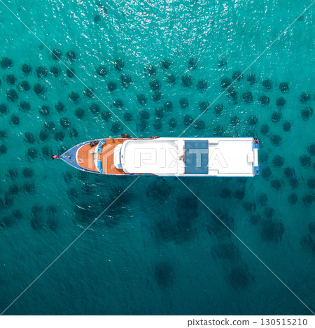 Aerial view of diving boat anchoring over the artificial reef at Racha Yai Island, Phuket, Thailand. 130515210