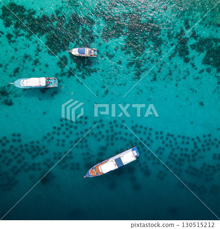 Aerial view of tour boats anchoring over the artificial reef at Racha Yai Island, Phuket, Thailand. 130515212