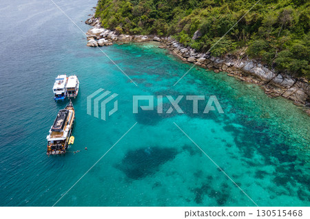 Recreational boats over turquoise clear water at Racha Noi Island in Phuket, Thailand. 130515468