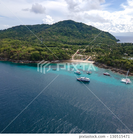 Aerial view of Koh Racha Yai Island with many tour boats in Phuket, Thailand. Aerial view of Koh Racha Yai Island with many tour boats in Phuket, Thailand. 130515471