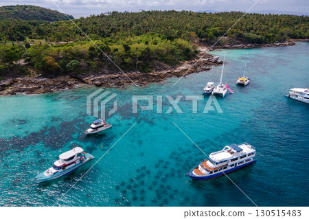 Aerial view of Koh Racha Yai Island with many tour boats around the bay, Phuket, Thailand. 130515483