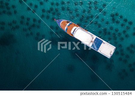 Aerial view of diving boat anchoring over the artificial reef at Racha Yai Island, Phuket, Thailand. 130515484