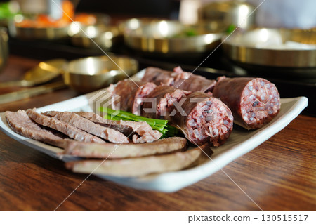 Korean Sausage (Sundae) Slices with Green Onions on Plate Korean Sausage (Sundae) Slices with Green Onions on Plate 130515517