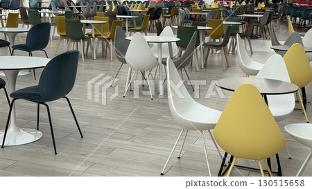 Empty cafeteria with colorful chairs and tables, suitable as a background for various themes 130515658