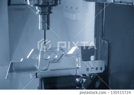 The 5-axis CNC milling machine cutting the aerospace part with solid flat nose end mill tool in the light blue scene. The 5-axis CNC milling machine cutting the aerospace part with solid flat nose end mill tool in the light blue scene. 130515724