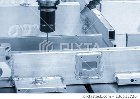 The CNC milling machine tapping process on the electric battery frame in the blue ton scene. The CNC milling machine tapping process on the electric battery frame in the blue ton scene. 130515726