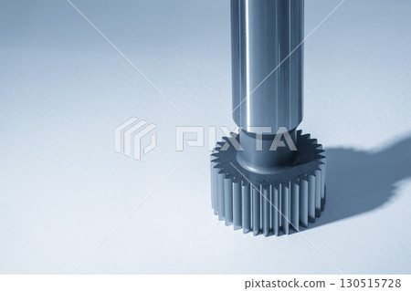Close up the transmission spline gear shaft parts in the light blue scene. 130515728