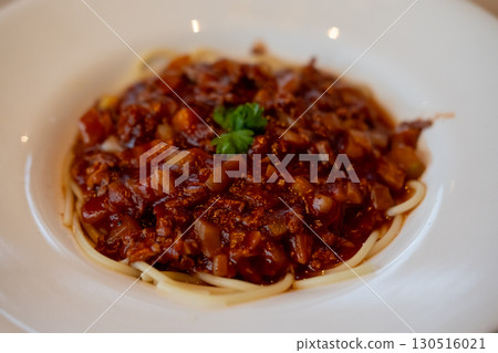 Spaghetti Bolognese, a meat-based sauce in Italian cuisine. served on plate Spaghetti Bolognese, a meat-based sauce in Italian cuisine. served on plate 130516021