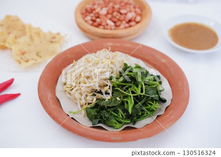 Traditional Asian Food with Vegetables and Peanut Dressing Traditional Asian Food with Vegetables and Peanut Dressing 130516324