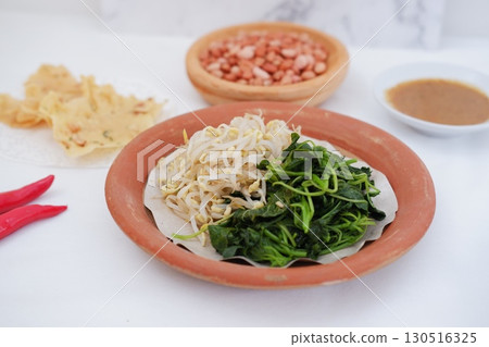 Traditional Asian Food with Vegetables and Peanut Dressing Traditional Asian Food with Vegetables and Peanut Dressing 130516325
