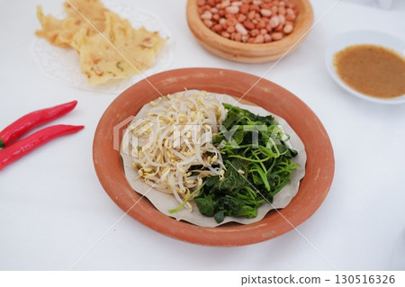 Traditional Asian Food with Vegetables and Peanut Dressing 130516326