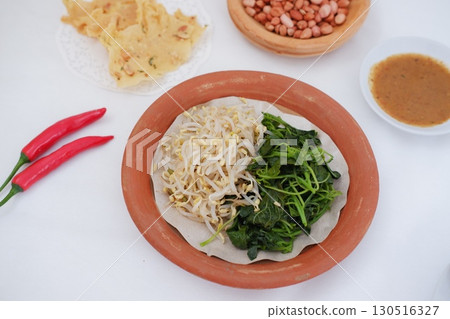 Traditional Asian Food with Vegetables and Peanut Dressing 130516327