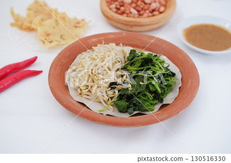 Traditional Asian Food with Vegetables and Peanut Dressing 130516330