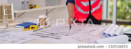 Skilled Architect Engineer Designs Detailed Building Project Blueprints Plans Construction Development Office Workstation Professional Collaboration 130516655