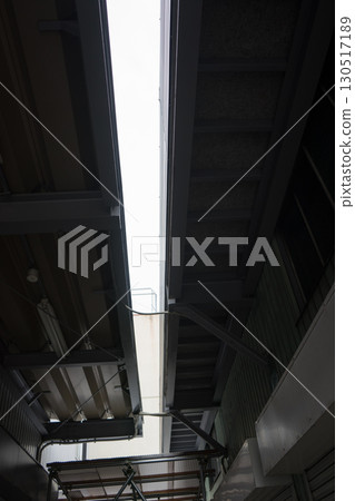 Looking up at the warehouse roof 130517189