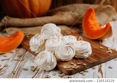 Homemade marshmallow dessert with pumpkin on wooden board and rustic background Homemade marshmallow dessert with pumpkin on wooden board and rustic background 130518129