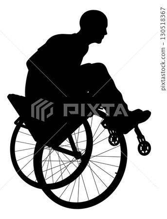 Silhouette of Man Performing Wheelchair Trick 130518367