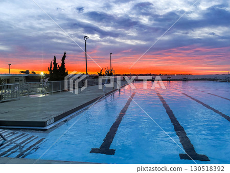 Sunrise View Over Swimming Pool With Vibrant Colors and Clear Sky in Babylon 130518392