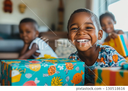 Portrait of smiling African American girl holding gift box at home joyful child Portrait of smiling African American girl holding gift box at home joyful child 130518616