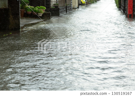 Roads in residential areas flooded by heavy rain from a typhoon Roads in residential areas flooded by heavy rain from a typhoon 130519167