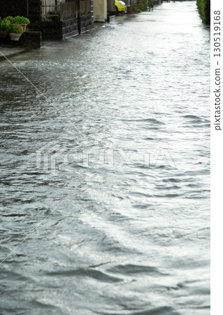 Roads in residential areas flooded by heavy rain from a typhoon Roads in residential areas flooded by heavy rain from a typhoon 130519168