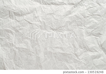 Wrinkled white package paper texture, isolated on background. Rough creased surface ideal for packaging, wrapping, crafts, scrapbooking, design, and artistic projects. Wrinkled white package paper texture, isolated on background. Rough creased surface ideal for packaging, wrapping, crafts, scrapbooking, design, and artistic projects. 130519248