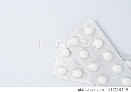 Two pills blister pack on white background, top view medical concept, healthcare, pharmacy, medication, and pharmaceutical product 130519249