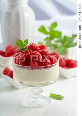 Panna cotta with fresh raspberries. 130519788