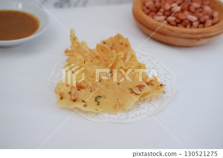 Crispy Peanut Rempeyek with Chili and Peanut Sauce 130521275