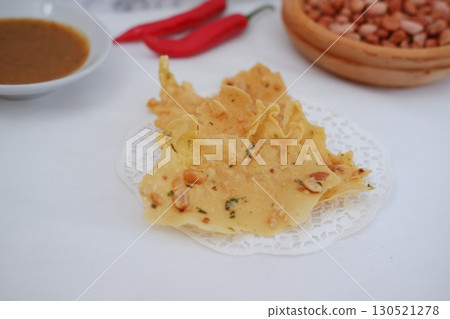 Crispy Peanut Rempeyek with Chili and Peanut Sauce 130521278